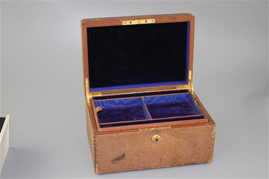 An Asprey of London leather jewellery box, with two interior trays and carrying handle, width, 25.4cm.